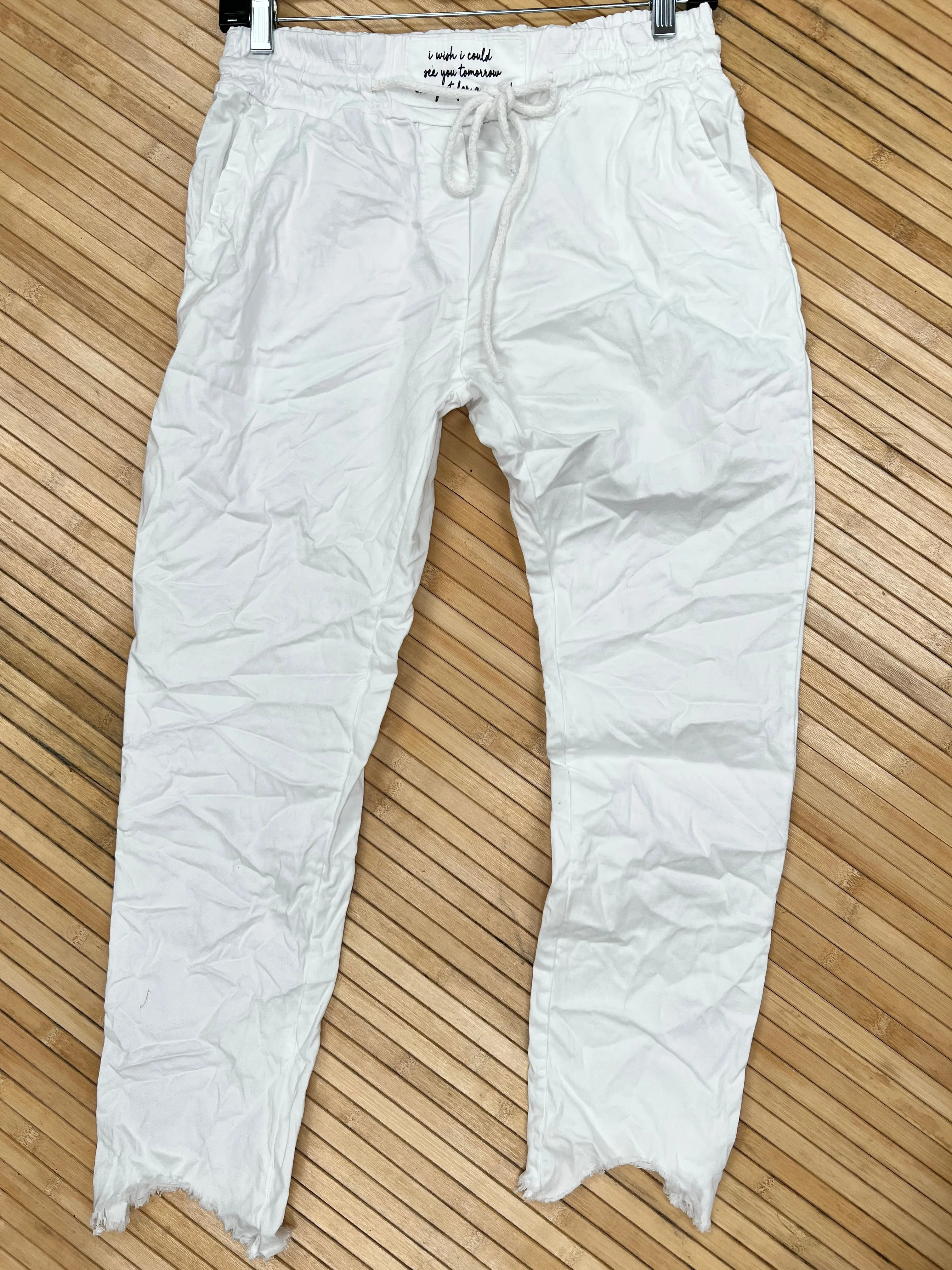 Distressed hem, Italian drawstring joggers.