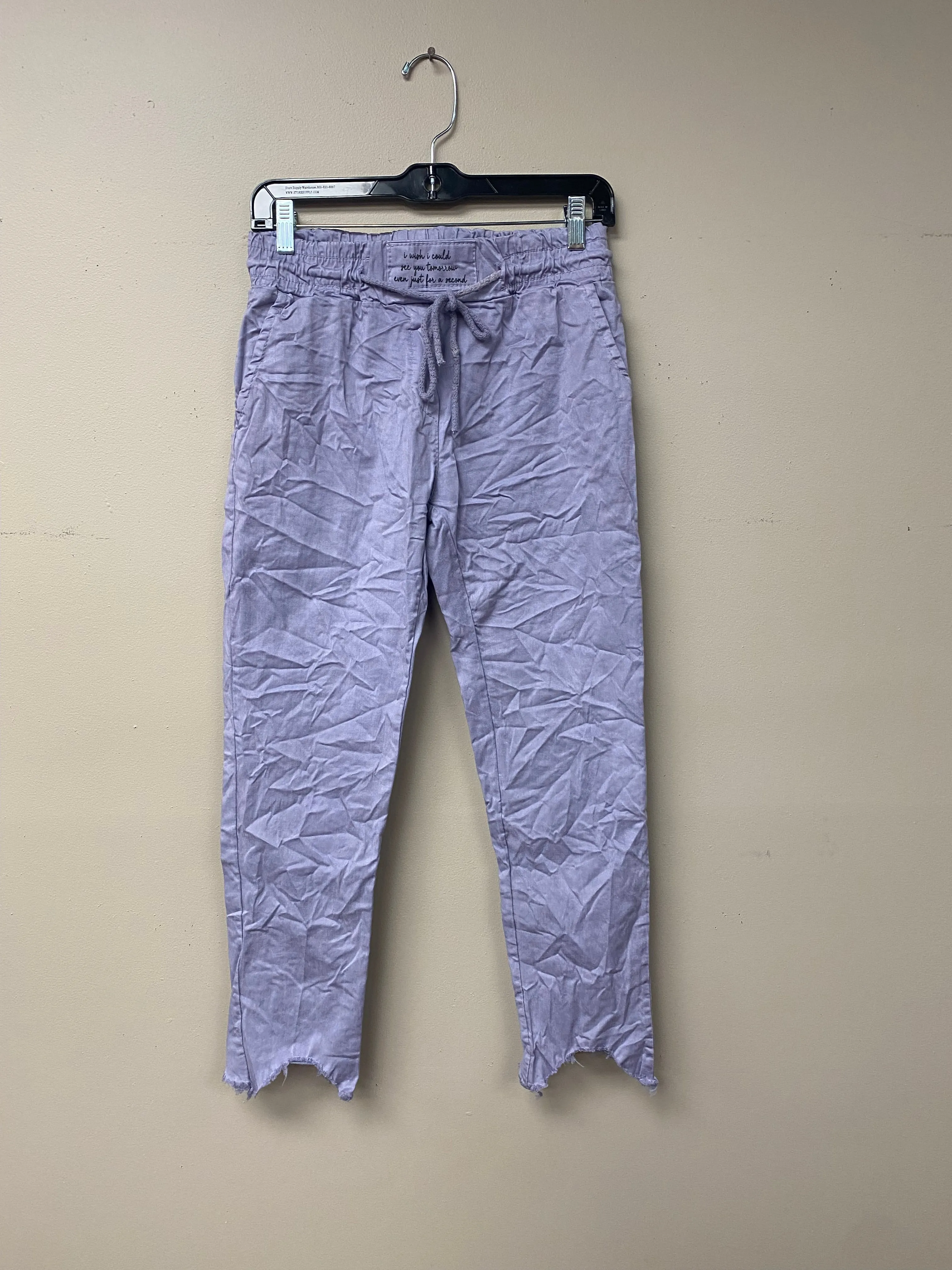 Distressed hem, Italian drawstring joggers.